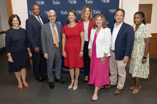 Group of people pictured in front of a Yale and United Way branded backdrop.